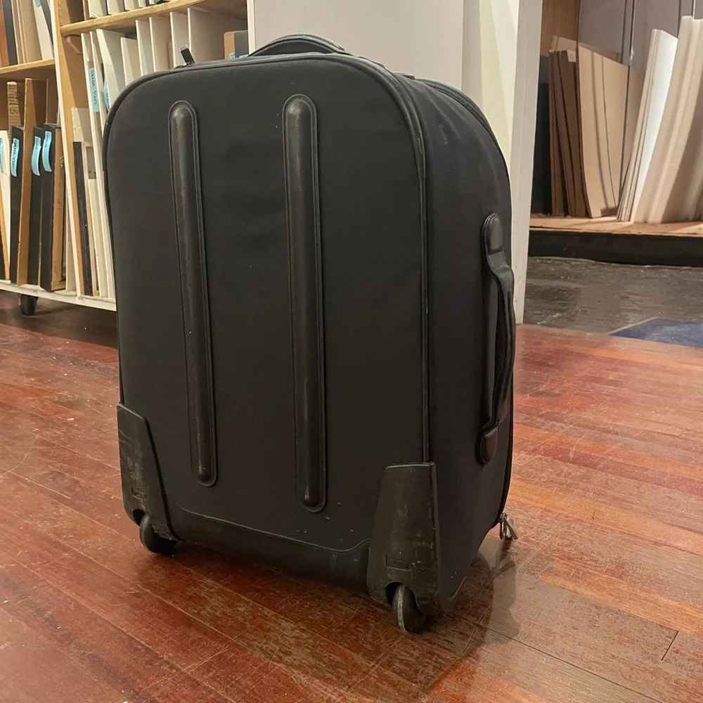 Tumi Black Rolling Suitcase